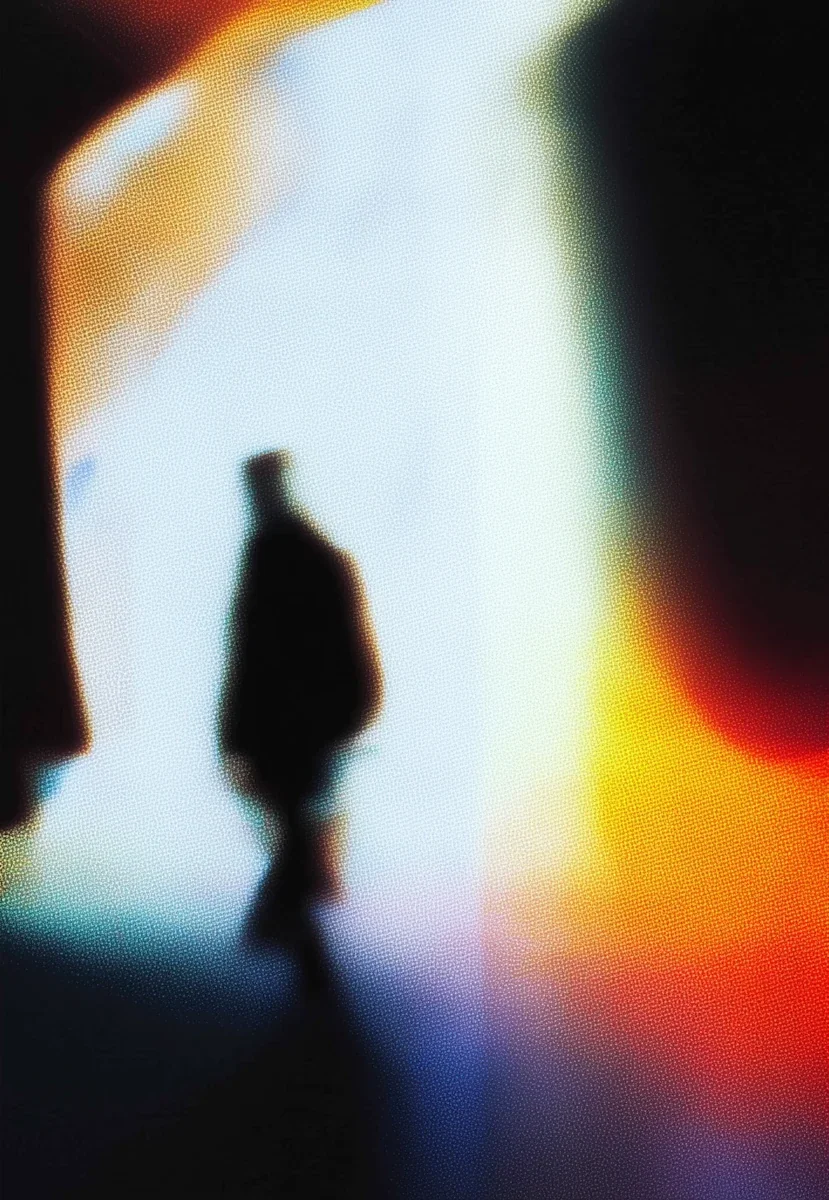 Specialist walking through a softly lit studio